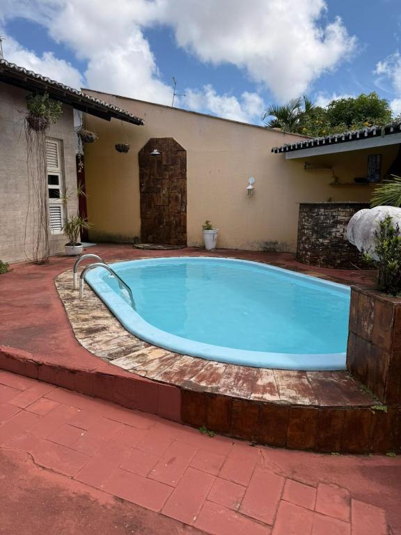 a swimming pool in the yard of a house at Natal Exclusive Pool Villa Private Community in Natal
