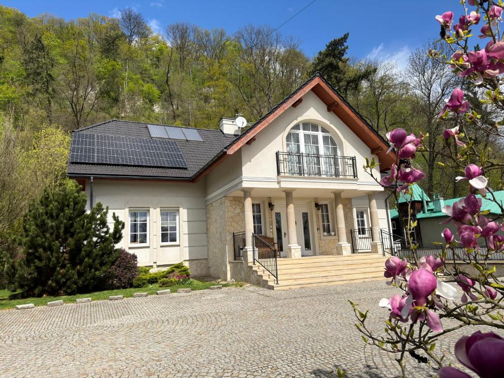 a house with solar panels on the roof at Villa Julia in Krakow