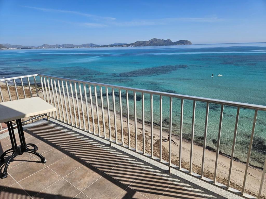 a balcony with a view of the ocean at Hawaii Beach Can Picafort in Can Picafort