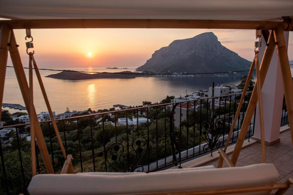 a balcony with a view of the ocean and a mountain at Sonias Point of View in Myrties
