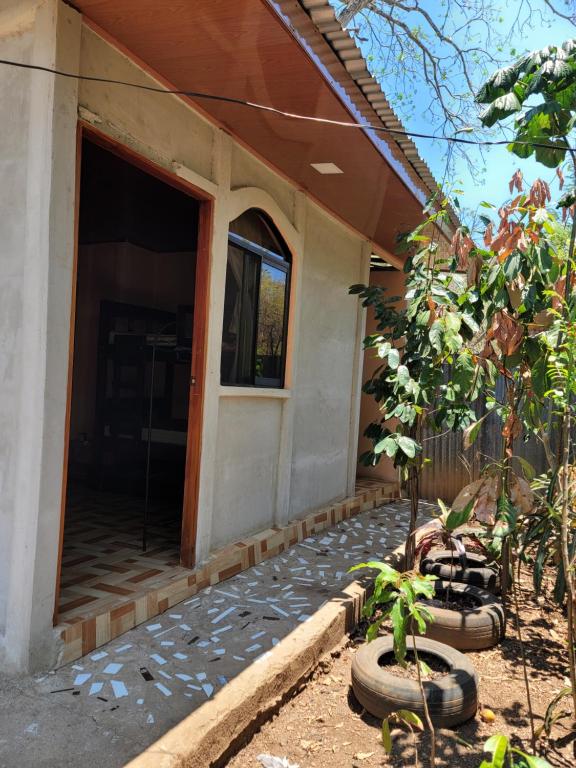 a house with a door leading to a porch at Alojamiento Artola para 4 personas in Sardinal