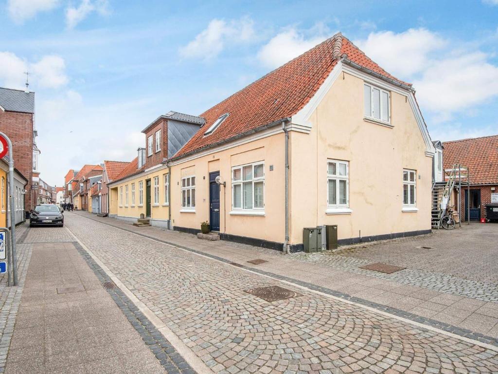 a cobblestone street in a town with buildings at 2 person holiday home in Ringkøbing in Ringkøbing