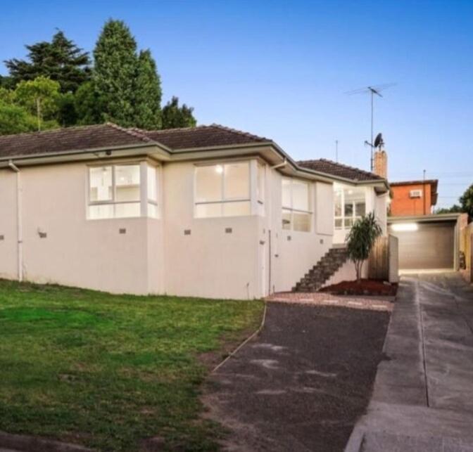 a large white house with a garage at Doncaster Westfiled House 4BD in Doncaster