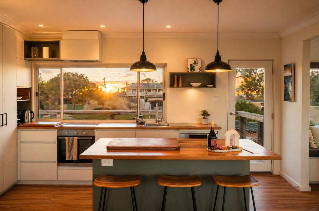 a kitchen with a counter and a large window at Central Goolwa- Coastal Family & Friend Retreat in Goolwa