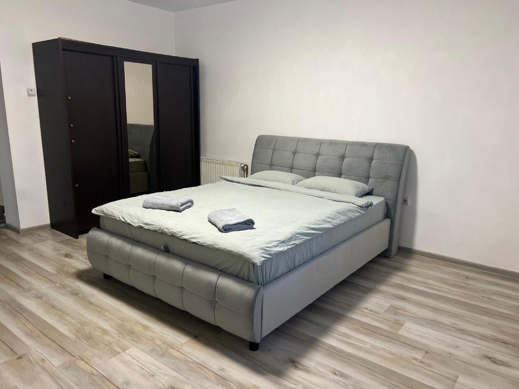 a large bed in a room with at Avram Iancu 365 in Floreşti