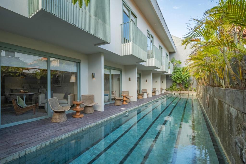 an image of a swimming pool at a villa at Studio O - Two-Floor Studio, Walk to the Beach in Seminyak