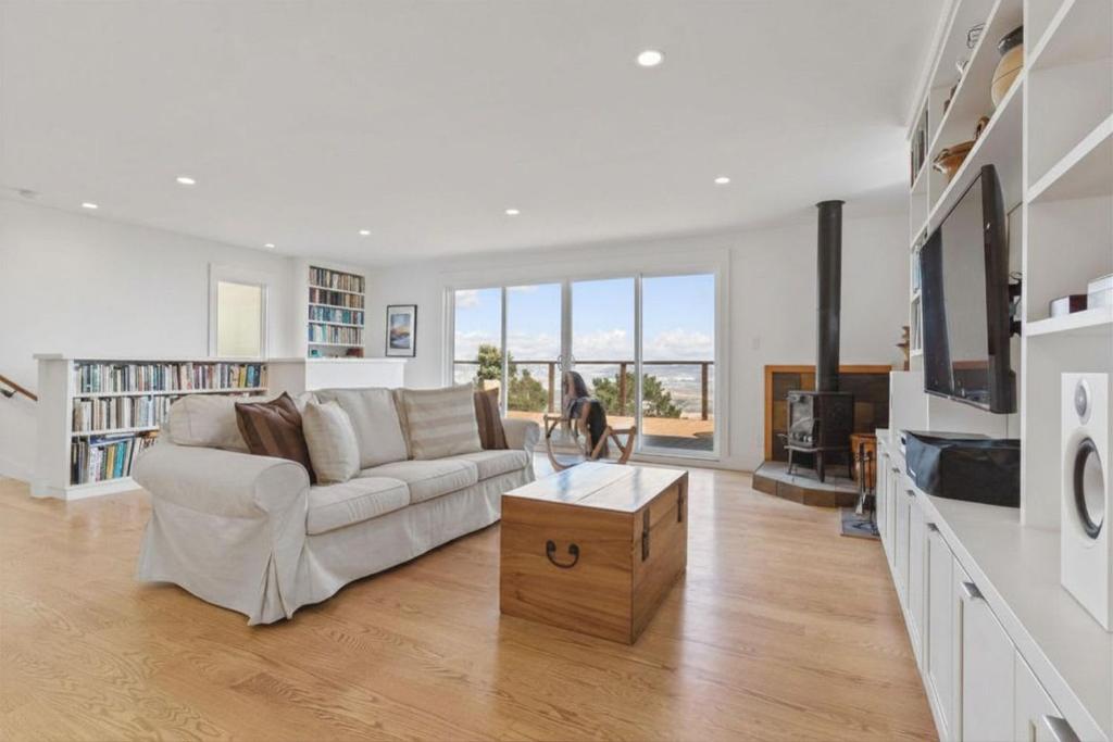 a living room with a couch and a dog in it at Stunning Views by the Bay 2BR in Brisbane