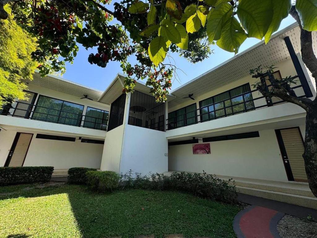 a large white building with a lot of windows at Mango Tree Resort in Chiang Mai