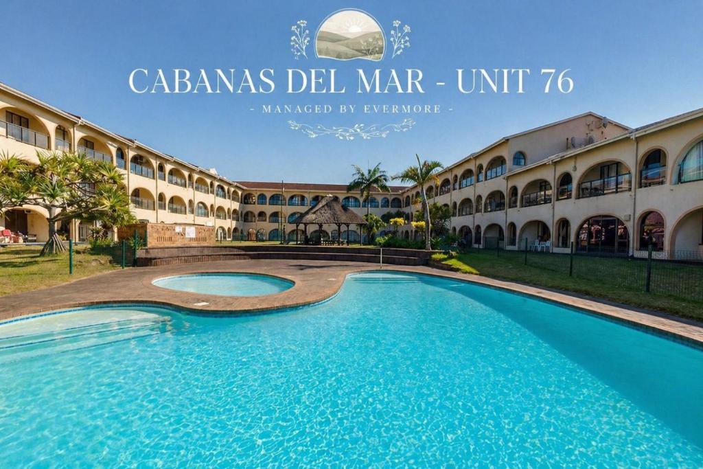 a large swimming pool in front of a building at Cabanas Del Mar 76 By Evermore in Kingsborough