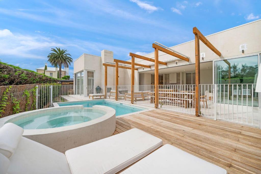 a villa with a swimming pool and a house at Lucia Sorrento in Sorrento