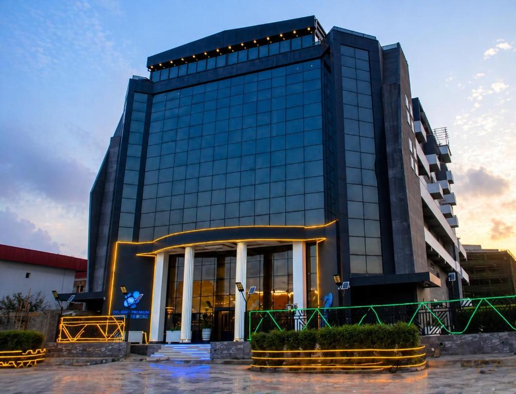 a tall black building with a glass front at Delight Premium Hotel in Djibouti