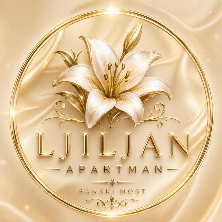 a gold plate with a white lily on it at Apartman Ljiljan in Sanski most