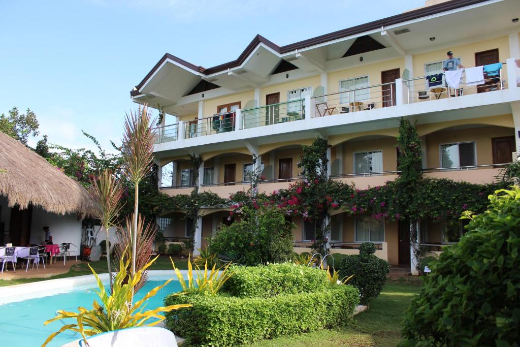 a view of the hotel from the pool at Vanilla Sky Dive Resort in Panglao Island