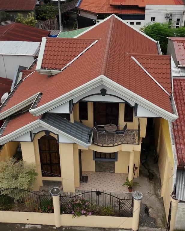 an overhead view of a house with a red roof at Rose Haven Staycation Panabo in Panabo