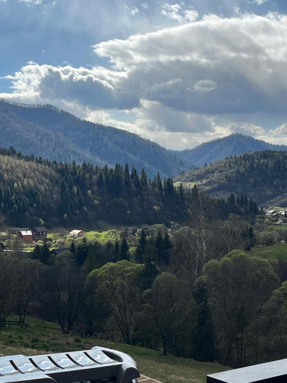 a view of a valley with trees and mountains at Nagoru house in Tukhlya