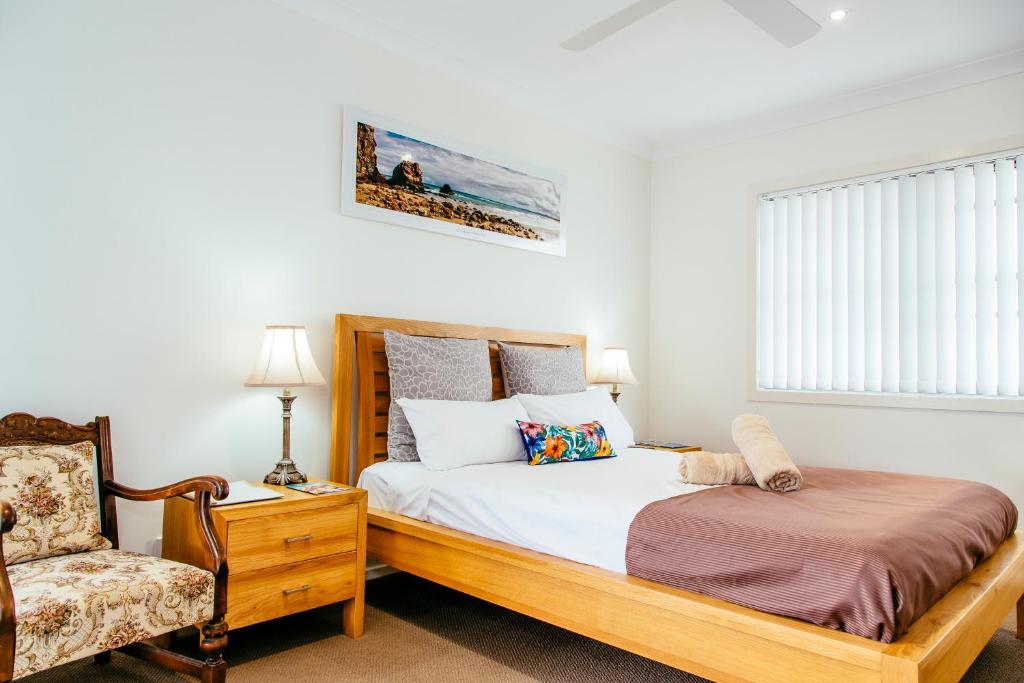 Postel nebo postele na pokoji v ubytování Coffs Jetty BnB