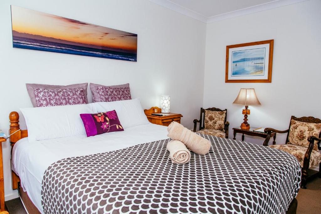 Postel nebo postele na pokoji v ubytování Coffs Jetty BnB