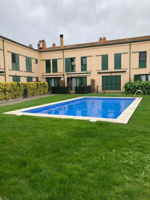 a large house with a swimming pool in the yard at Kalma Samaria in Pals