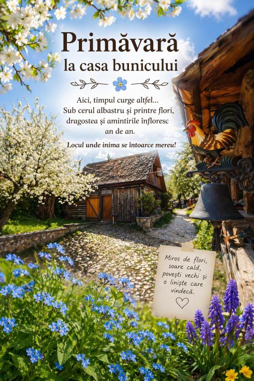 a poster of a garden with a sign and flowers at Casa Bunicului in Poplaca