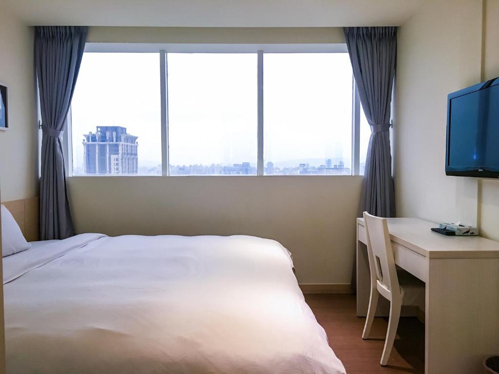 Postel nebo postele na pokoji v ubytování Wemeet Hotel Taipei