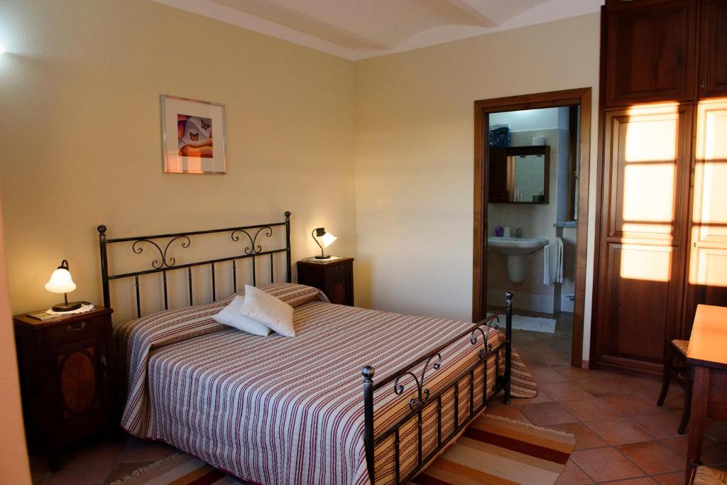 Postel nebo postele na pokoji v ubytování Cascina La Corte