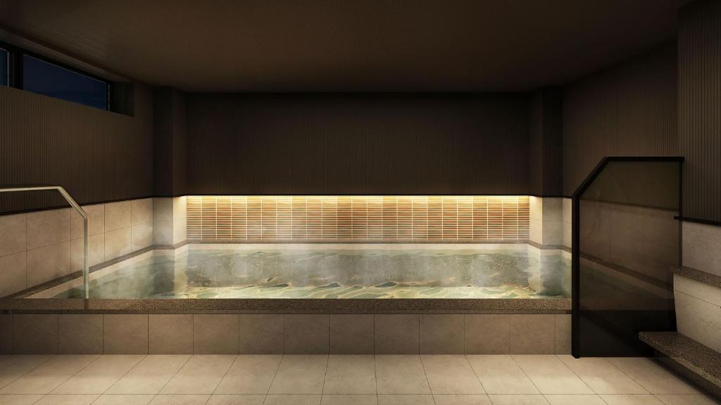 a jacuzzi tub in a room with stairs at HOTEL GLOBAL VIEW Morioka in Morioka