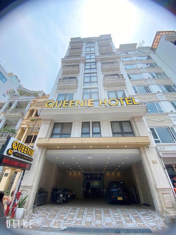 a white building with a hotel sign on it at Khách sạn QUEENIE in Hai Phong