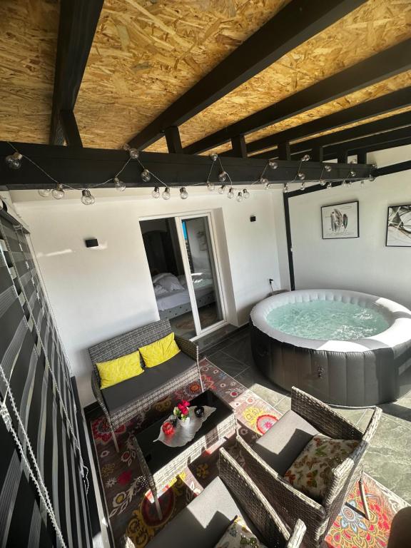 an overhead view of a hot tub in a room at Apt Amor in Bihać