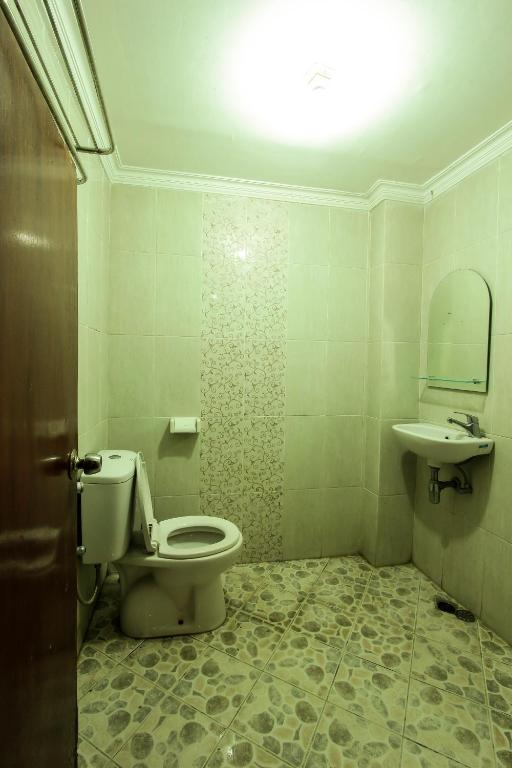 Koupelna v ubytování Griya Langen Guesthouse