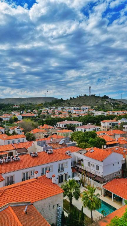 an aerial view of a city with orange roofs at Jardin d'Azur Alaçatı in Alaçatı