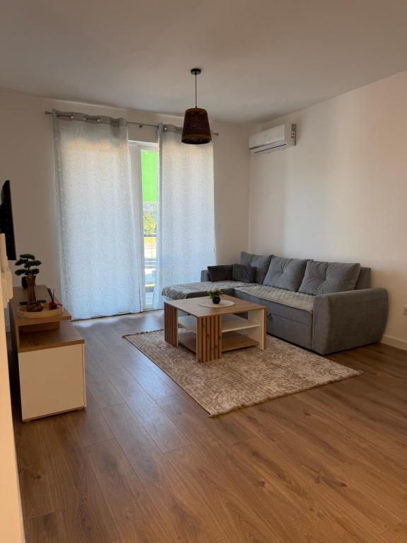 a living room with a couch and a coffee table at City Break Sarajevo in Sarajevo
