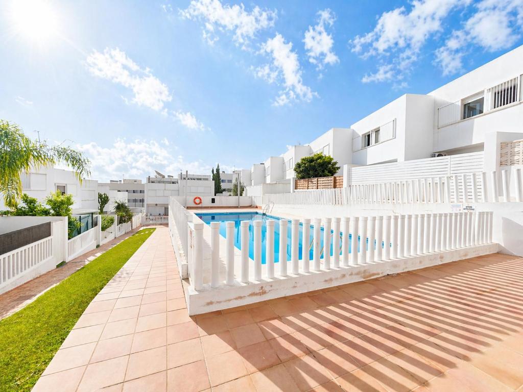 an exterior view of a house with a swimming pool at Apartamento Luna en Conil in Conil de la Frontera