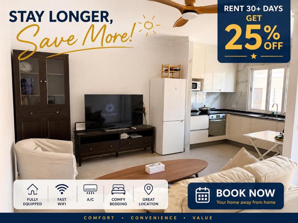 a sign that says stay longer save more in a living room at Roca Playa Mogan in Puerto de Mogán
