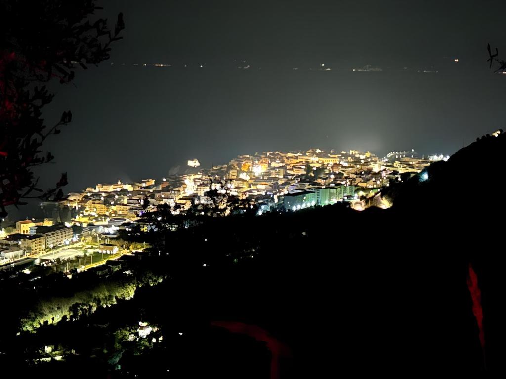 a view of a city lit up at night at Tropea's green terrace in Tropea