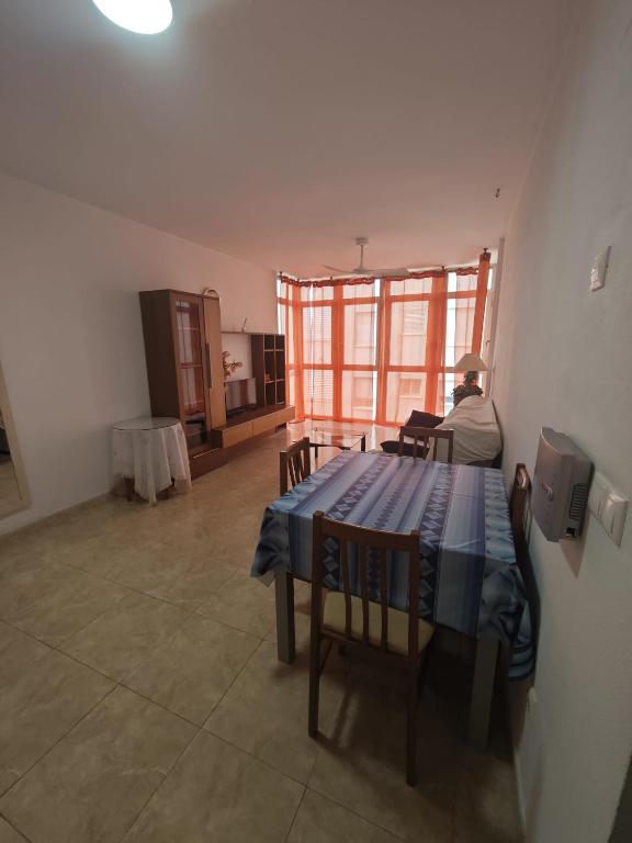 a man sitting at a table in a room at Altet San Francisco in El Alted