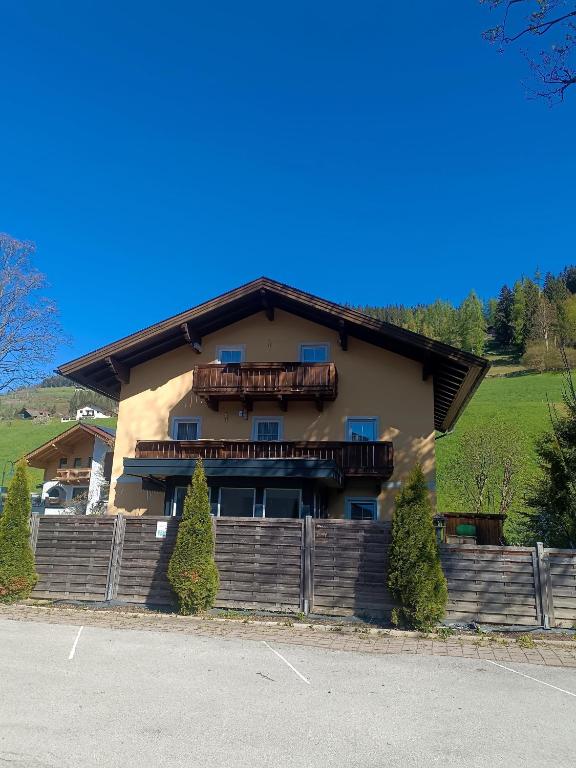 a house with a balcony on top of it at Haus Moser in Wagrain