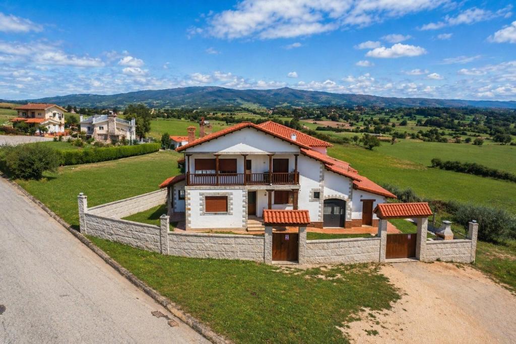 a house on a hill with a fence at El Carloto Lanchares in Lanchares