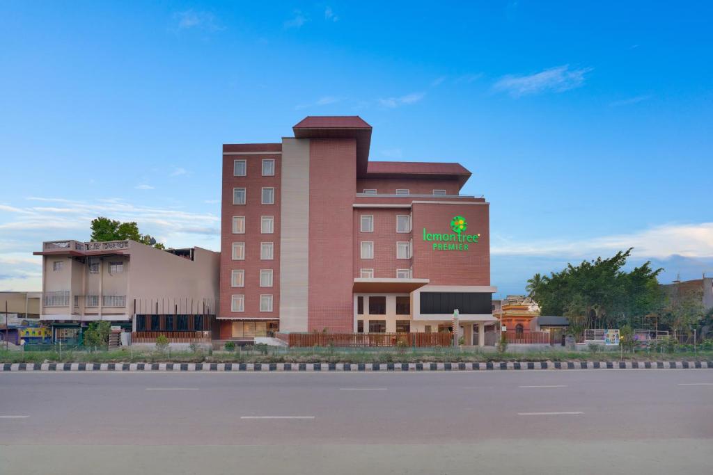 a large red building with a sign on it at Lemon Tree Premier, Biratnagar, Nepal in Biratnagar
