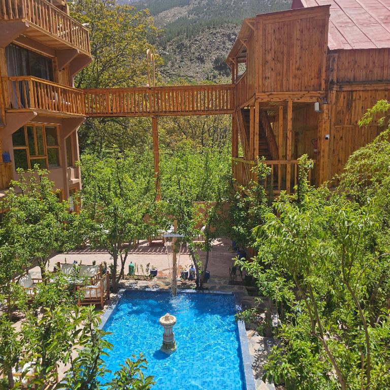 an overhead view of a swimming pool in front of a house at Afla views in Imlil