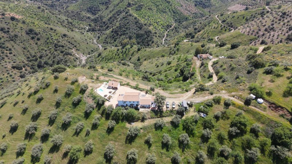 an aerial view of a house on a mountain at Hacienda Gallego in Málaga