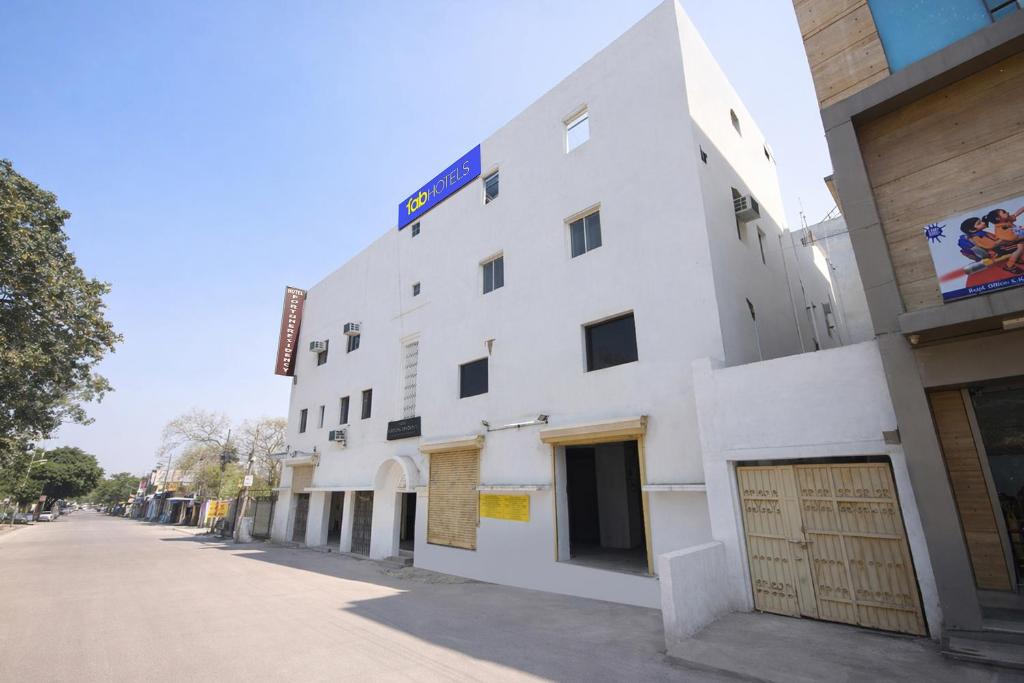 a white building on the side of a street at FabHotel The Fortune in New Delhi