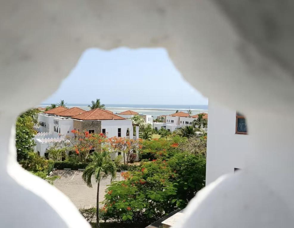 a view from a window of a house at WakaWaka SeaView Beach Condo in Mombasa