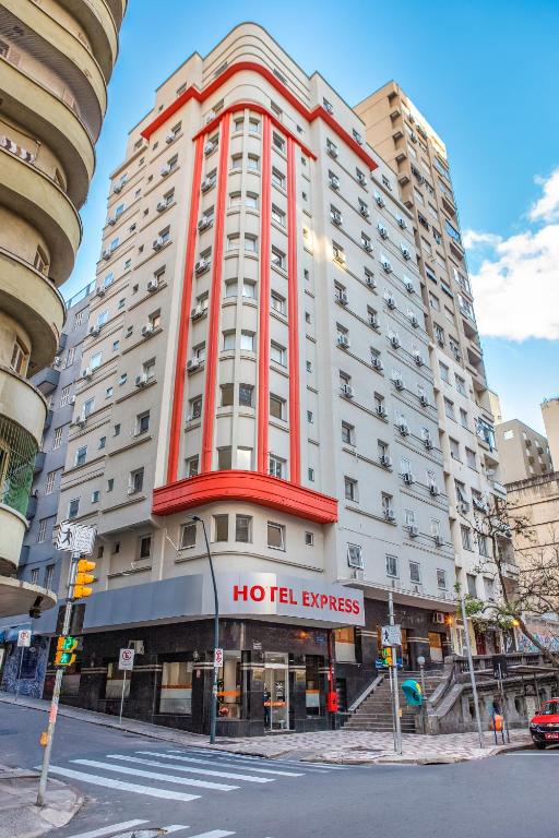 a large building with a hotel services sign on it at Hotel Express Savoy - Centro Histórico in Porto Alegre