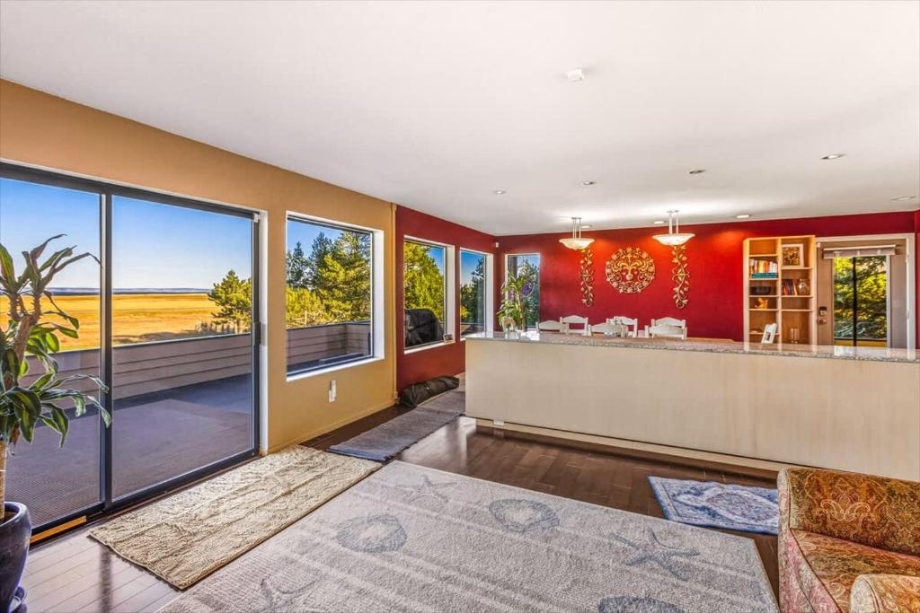 an empty living room with a bar with a view at Spacious Gracious & Luxurious Retreat in Westport