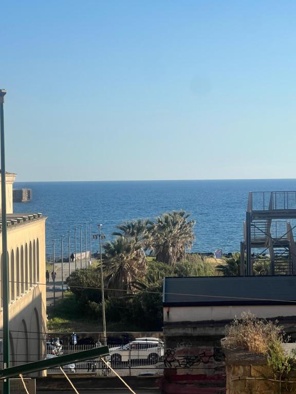 a view of the ocean from a building at Casa Castellano in Naples
