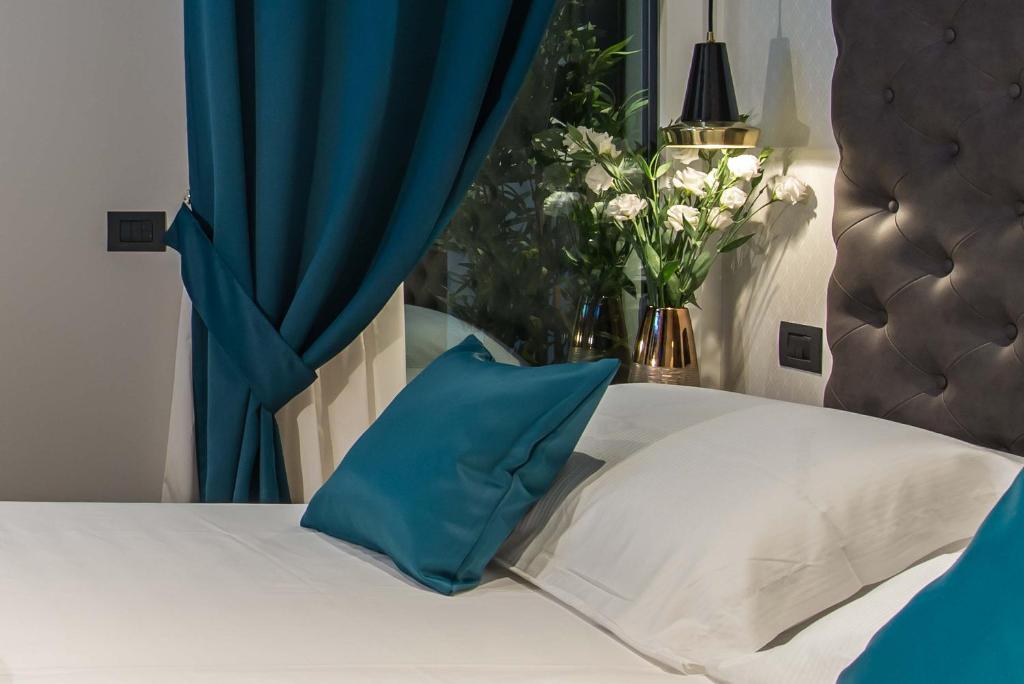Postel nebo postele na pokoji v ubytování Navona Street Hotel