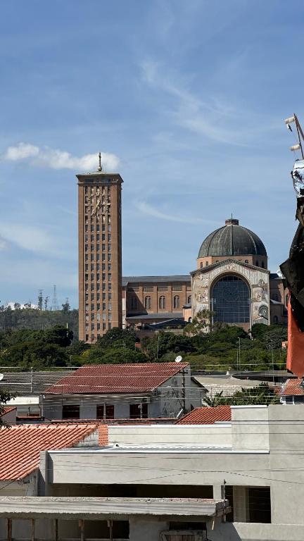 a view of a city with a building and a clock tower at Casa Aparecida in Aparecida