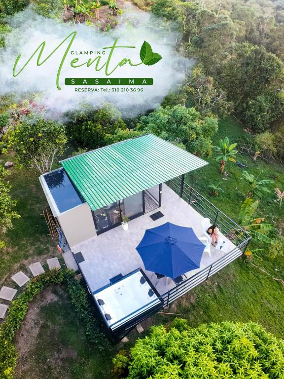 an aerial view of a house with an umbrella at MeNTA GLAMPING in Sasaima