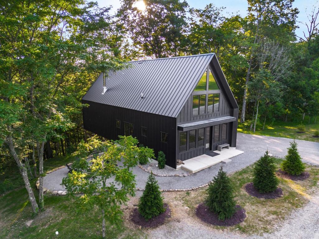 an overhead view of a black house with trees at Highpoint in New Plymouth