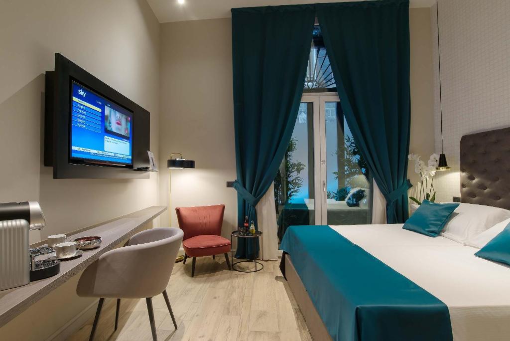 Postel nebo postele na pokoji v ubytování Navona Street Hotel